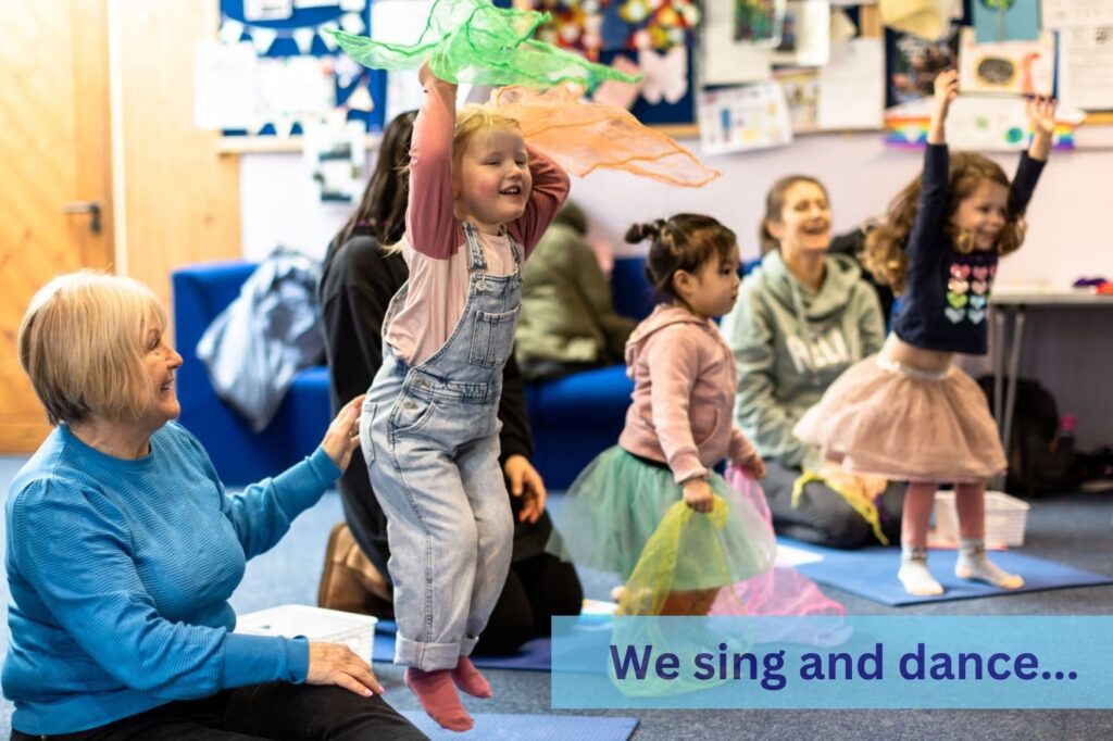 children dance with scarves